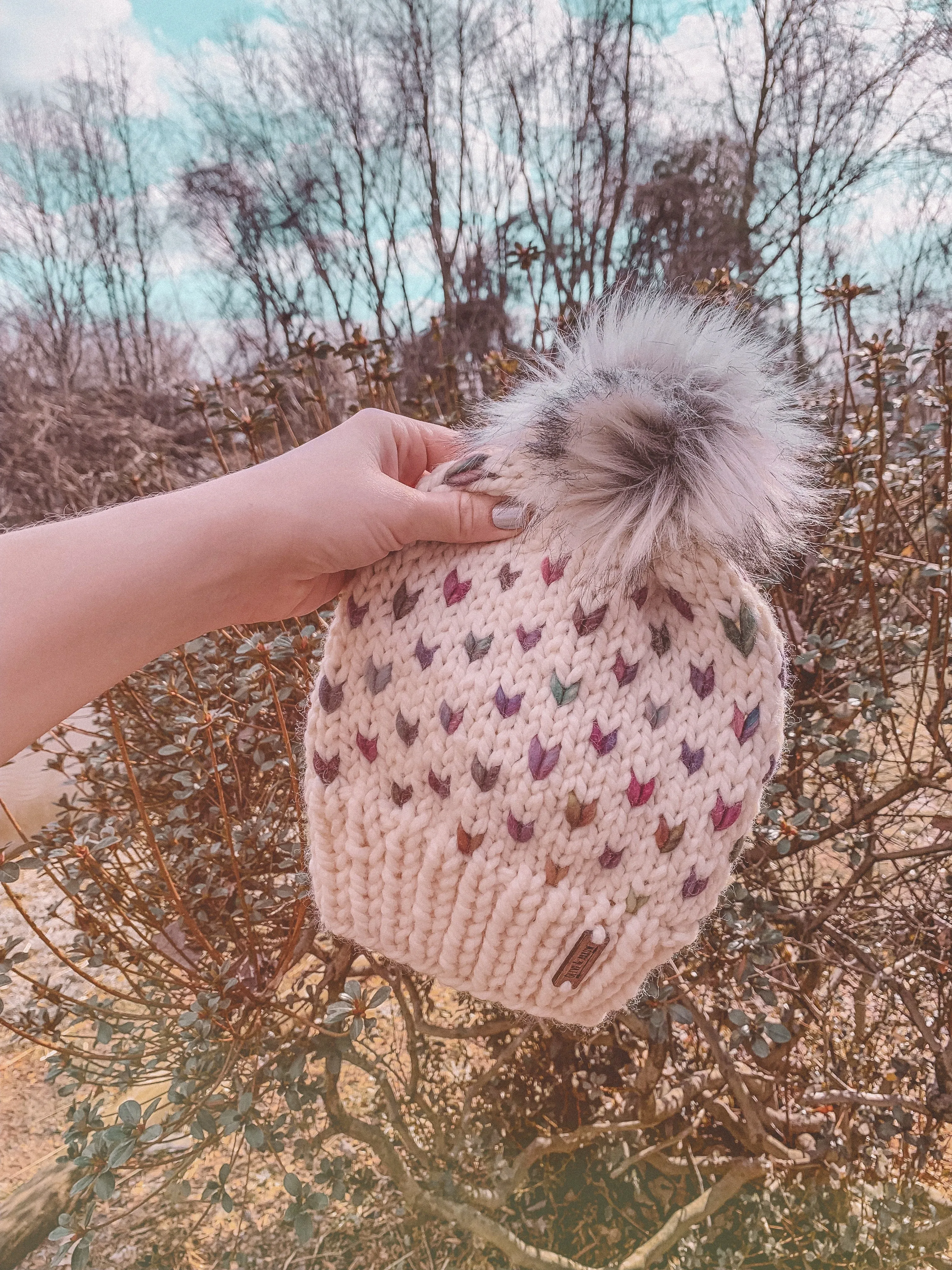 Adult Knitted Fair Isle Rainbow Hearts Beanie with Faux Fur Pom Pom