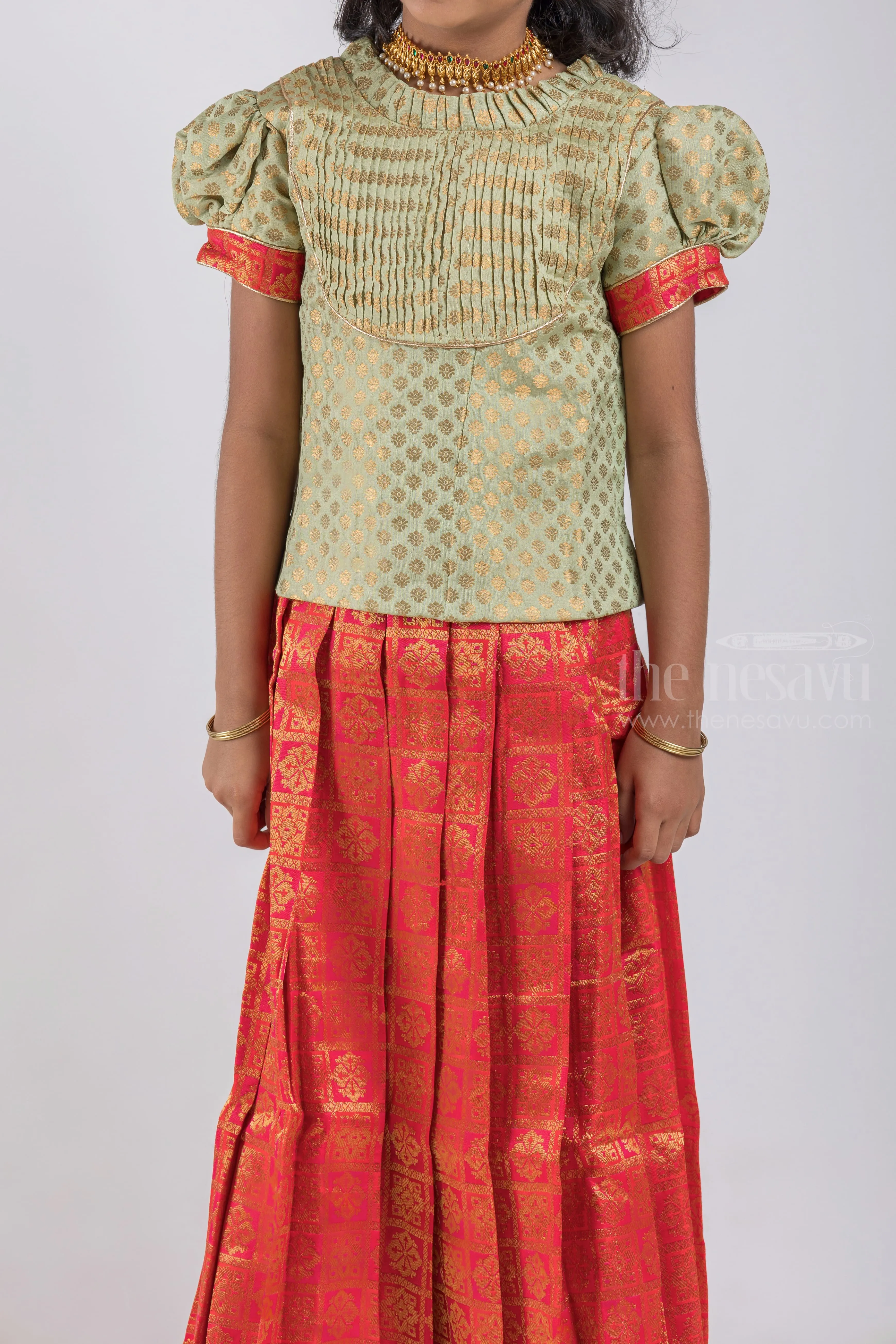 Pretty Lite Green Floral Designer Blouse And Orange Pleated Designer Silk Skirt For Girls